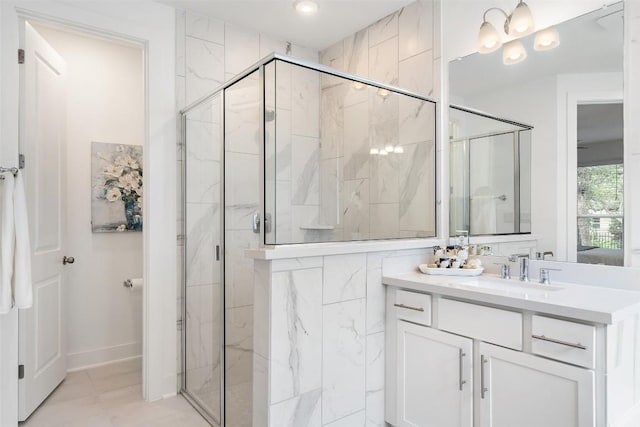 bathroom featuring vanity and a shower with shower door