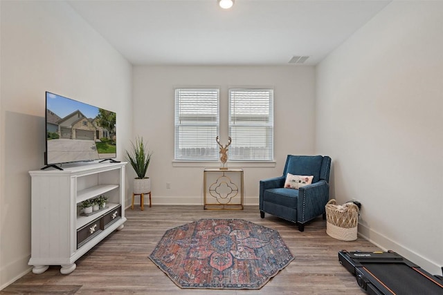 sitting room featuring hardwood / wood-style floors