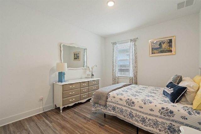 bedroom featuring dark hardwood / wood-style floors