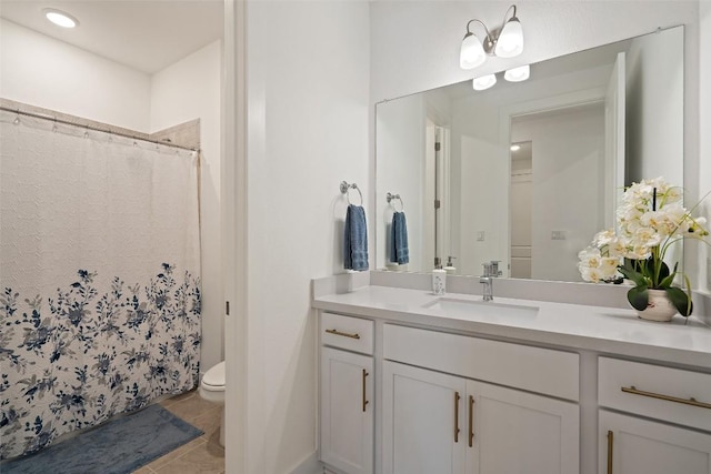 bathroom featuring tile patterned floors, vanity, toilet, and a shower with shower curtain