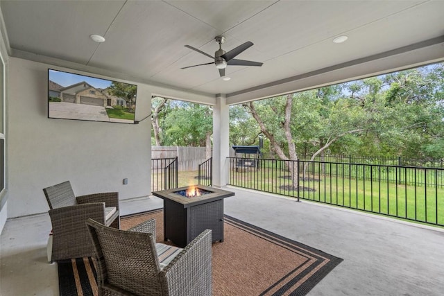 view of patio / terrace featuring ceiling fan and an outdoor fire pit