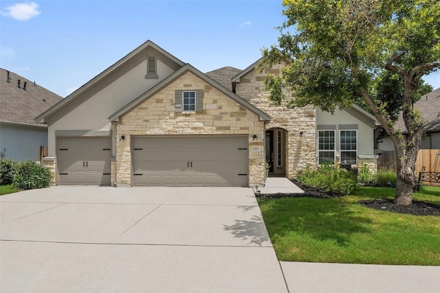 view of front facade featuring a garage and a front lawn