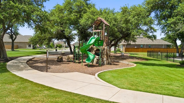 view of jungle gym with a lawn