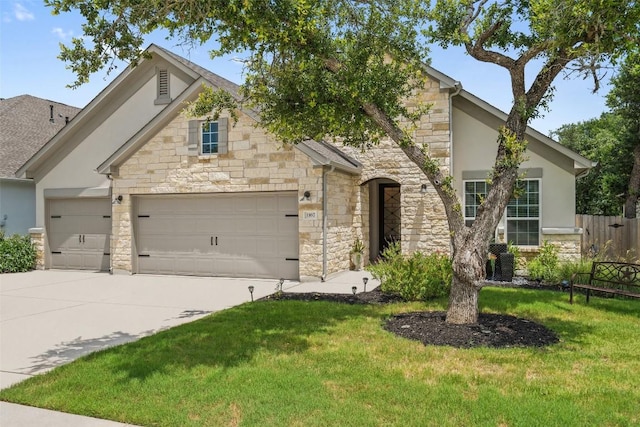 view of front facade featuring a front yard and a garage