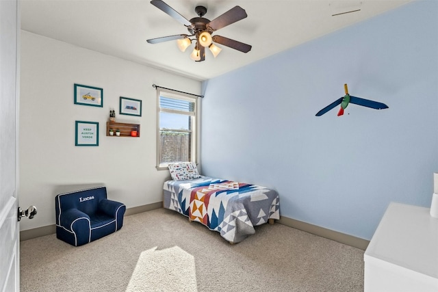 carpeted bedroom featuring ceiling fan