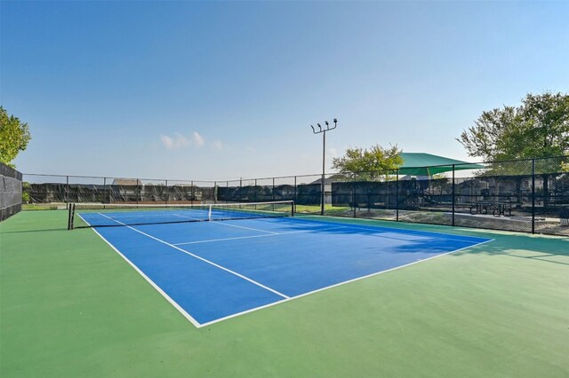 view of sport court with basketball hoop