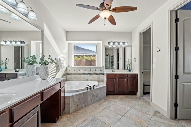 bathroom with tile patterned floors, plus walk in shower, vanity, and ceiling fan