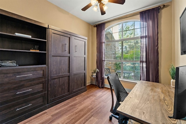 office space featuring light wood-type flooring and ceiling fan