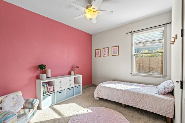 carpeted bedroom with ceiling fan