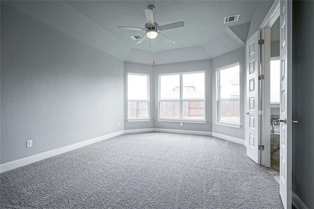 carpeted spare room with ceiling fan