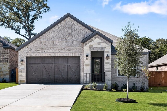 view of front facade with a garage and a front yard