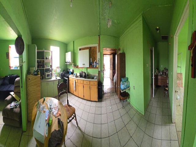 kitchen with light tile patterned floors and gas stove