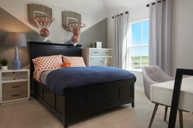 bedroom featuring light colored carpet and lofted ceiling