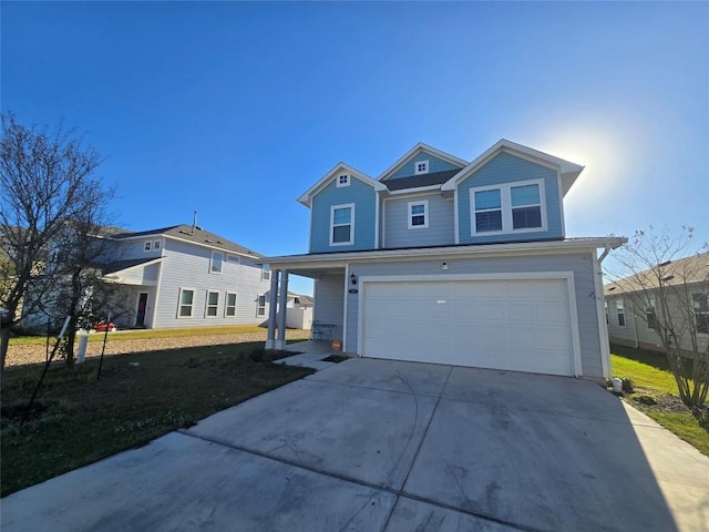 view of property with a garage and a front yard