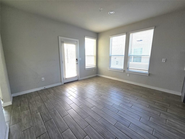 empty room featuring dark wood-type flooring