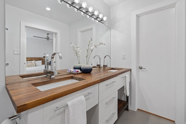 8518 Fathom Cir Unit 133, Austin, TX 78750 - ensuite bathroom with double vanity and recessed lighting