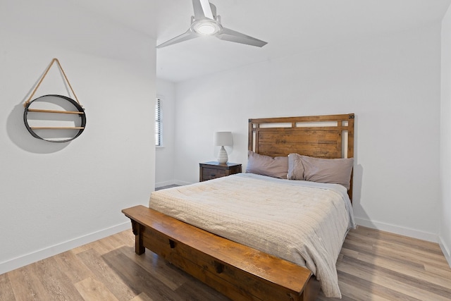 8518 Fathom Cir Unit 133, Austin, TX 78750 - bedroom featuring baseboards, light wood-type flooring, and ceiling fan