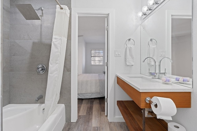 8518 Fathom Cir Unit 133, Austin, TX 78750 - ensuite bathroom featuring shower / tub combo with curtain, wood finished floors, and vanity