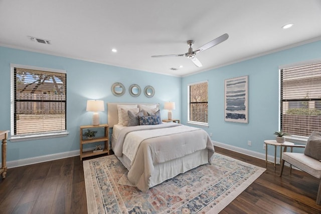 bedroom with ceiling fan, dark wood-type flooring, and ornamental molding