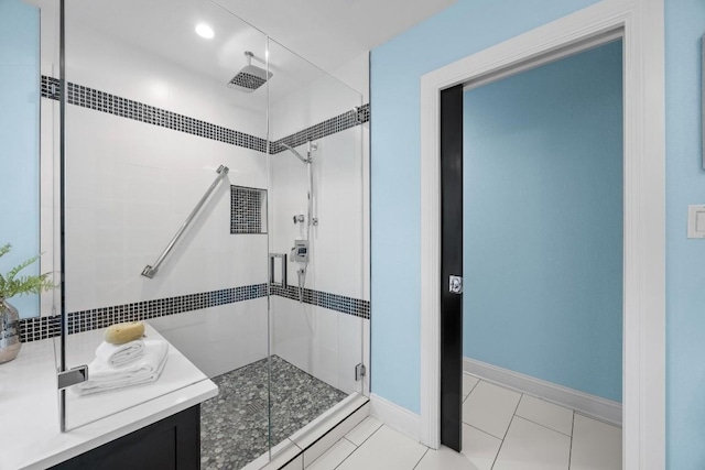 bathroom with tile patterned flooring, vanity, and an enclosed shower