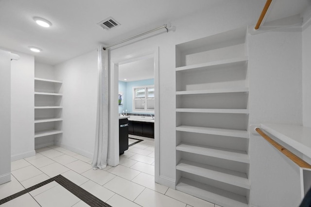 walk in closet featuring tile patterned floors