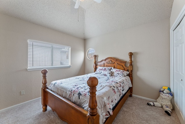 bedroom with light carpet, a closet, and ceiling fan