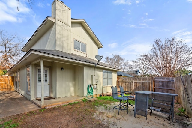 back of house with a patio area