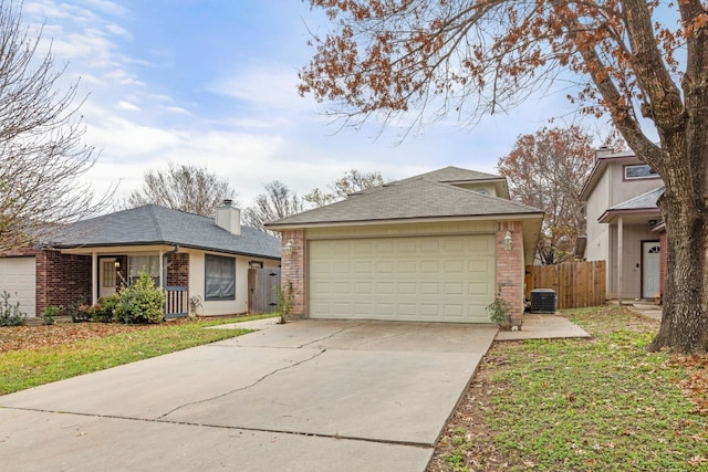 ranch-style home featuring a front yard and a garage