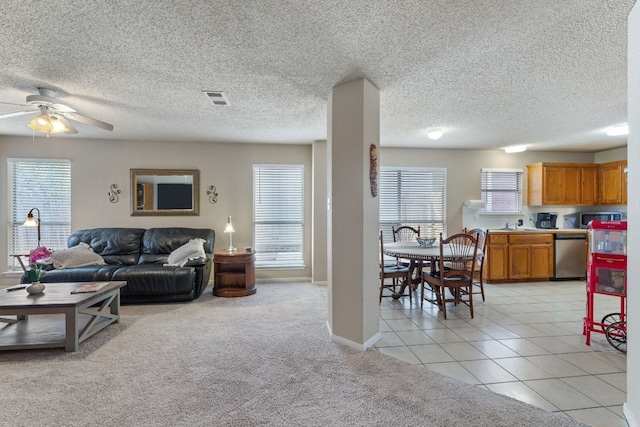 tiled living room featuring ceiling fan