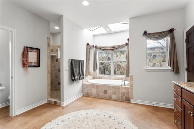 bathroom with tile patterned flooring, vanity, and shower with separate bathtub