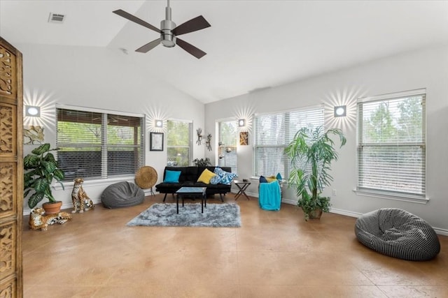 sitting room featuring ceiling fan, a healthy amount of sunlight, and lofted ceiling