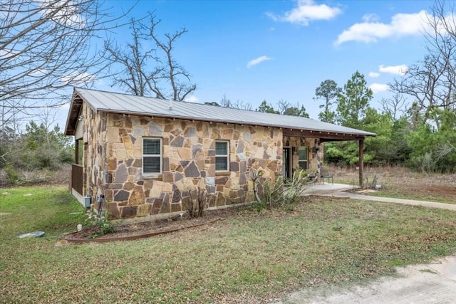 view of outbuilding with a lawn