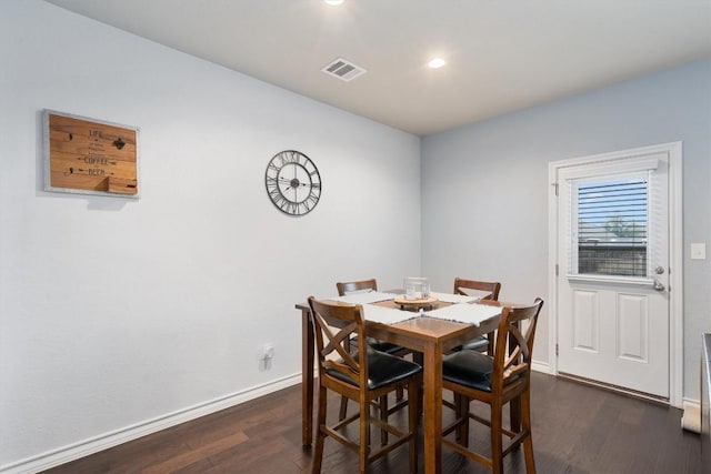 dining room with dark wood-type flooring