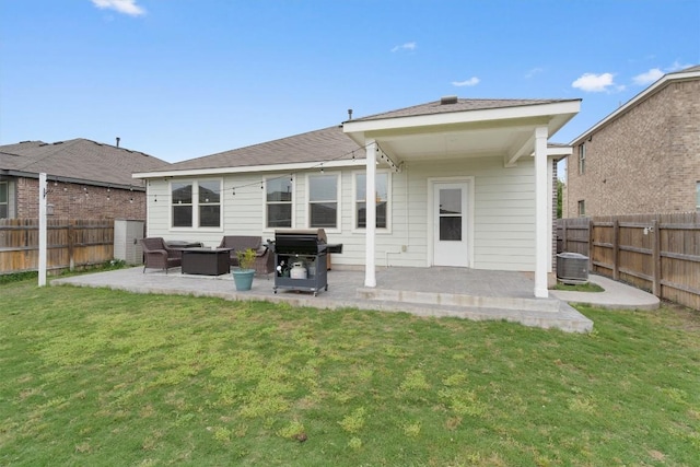 back of property featuring a lawn, a patio area, and an outdoor hangout area