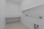 133 Gouda Dr, Bastrop, TX 78602 - washroom with baseboards and hookup for a gas dryer