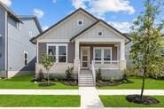 133 Gouda Dr, Bastrop, TX 78602 - bungalow-style house featuring a front lawn
