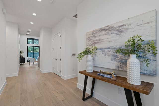 hall with light wood-type flooring