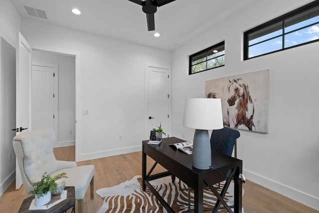 office area with ceiling fan and light hardwood / wood-style floors