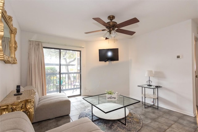 tiled living room with ceiling fan