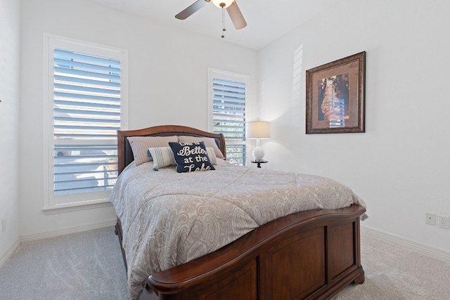 bedroom with light colored carpet and ceiling fan