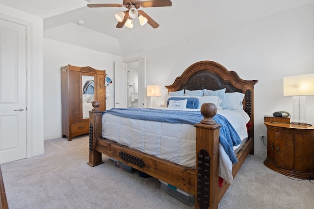 carpeted bedroom with ceiling fan and lofted ceiling