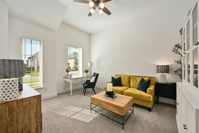 carpeted living room featuring ceiling fan