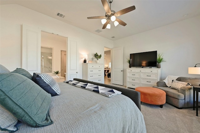 carpeted bedroom with ceiling fan and ensuite bathroom