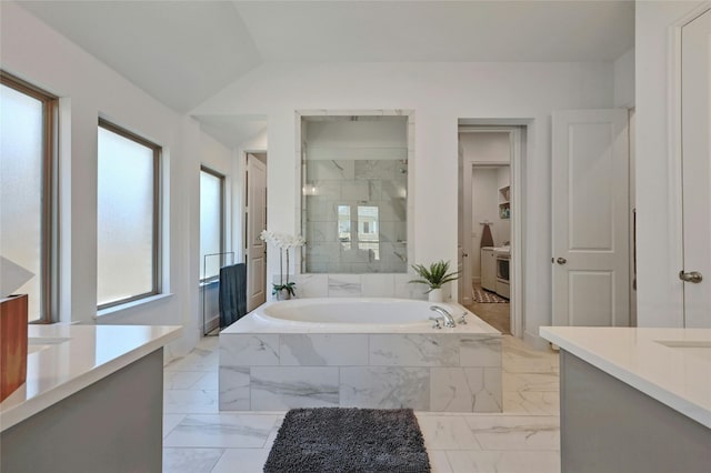 bathroom featuring vanity and shower with separate bathtub