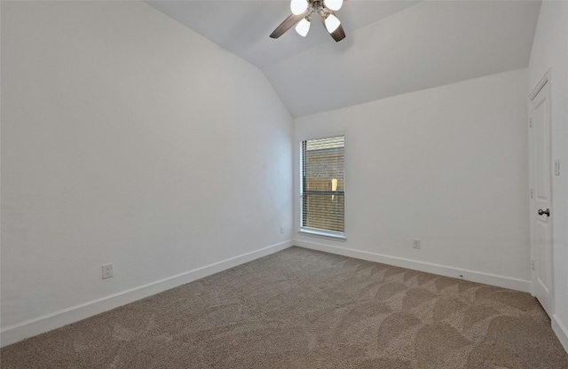 spare room with carpet flooring, ceiling fan, and lofted ceiling