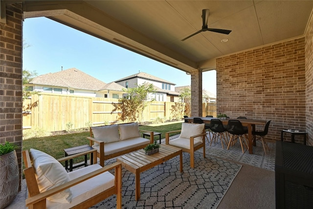 view of patio with outdoor lounge area and ceiling fan