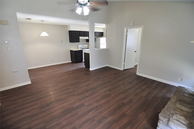 unfurnished living room with ceiling fan and dark hardwood / wood-style flooring