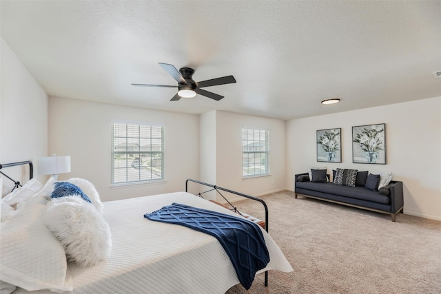 bedroom with ceiling fan and carpet