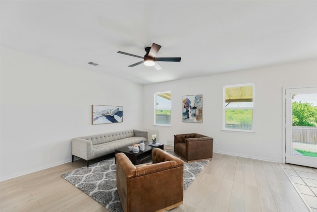 living room featuring ceiling fan and light wood-type flooring