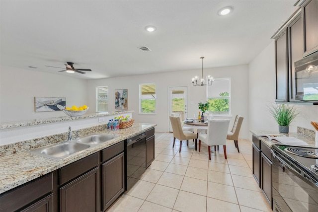 kitchen with dark brown cabinets, ceiling fan with notable chandelier, sink, pendant lighting, and dishwasher